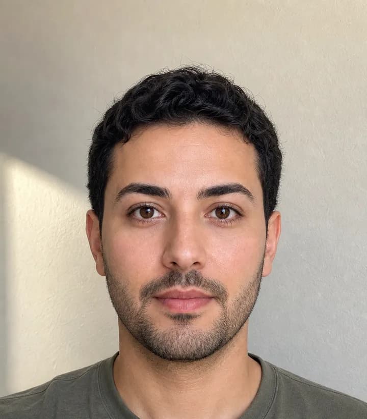 A casual phone selfie before it is made into a Algeria passport photo