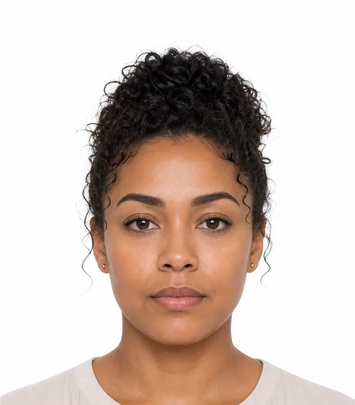 Finished compliant Antigua and Barbuda passport photo (35 x 45 mm) on a plain background