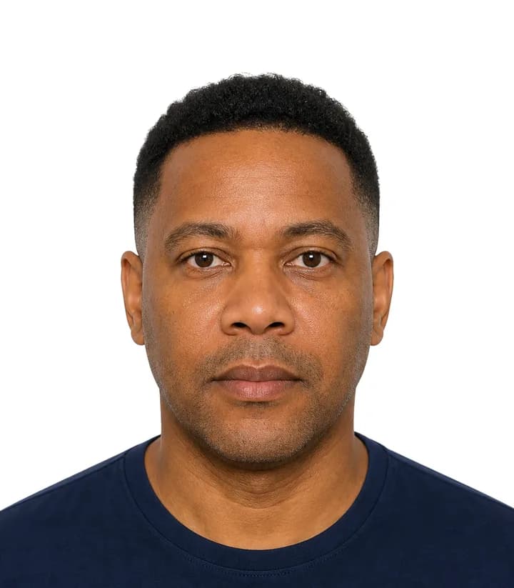 Finished compliant Grenada passport photo (38.1 x 50.8 mm) on a plain background