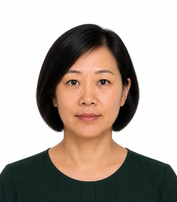 Finished compliant Singapore passport photo (35 x 45 mm) on a plain background