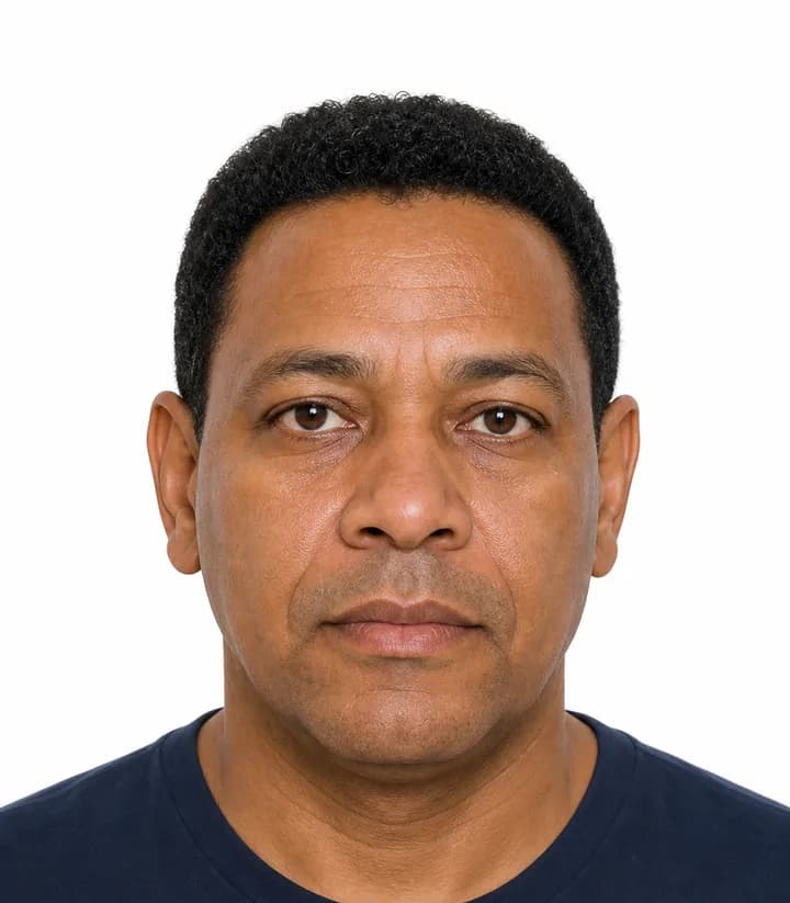Finished compliant Trinidad and Tobago passport photo (2 x 2 in) on a plain background